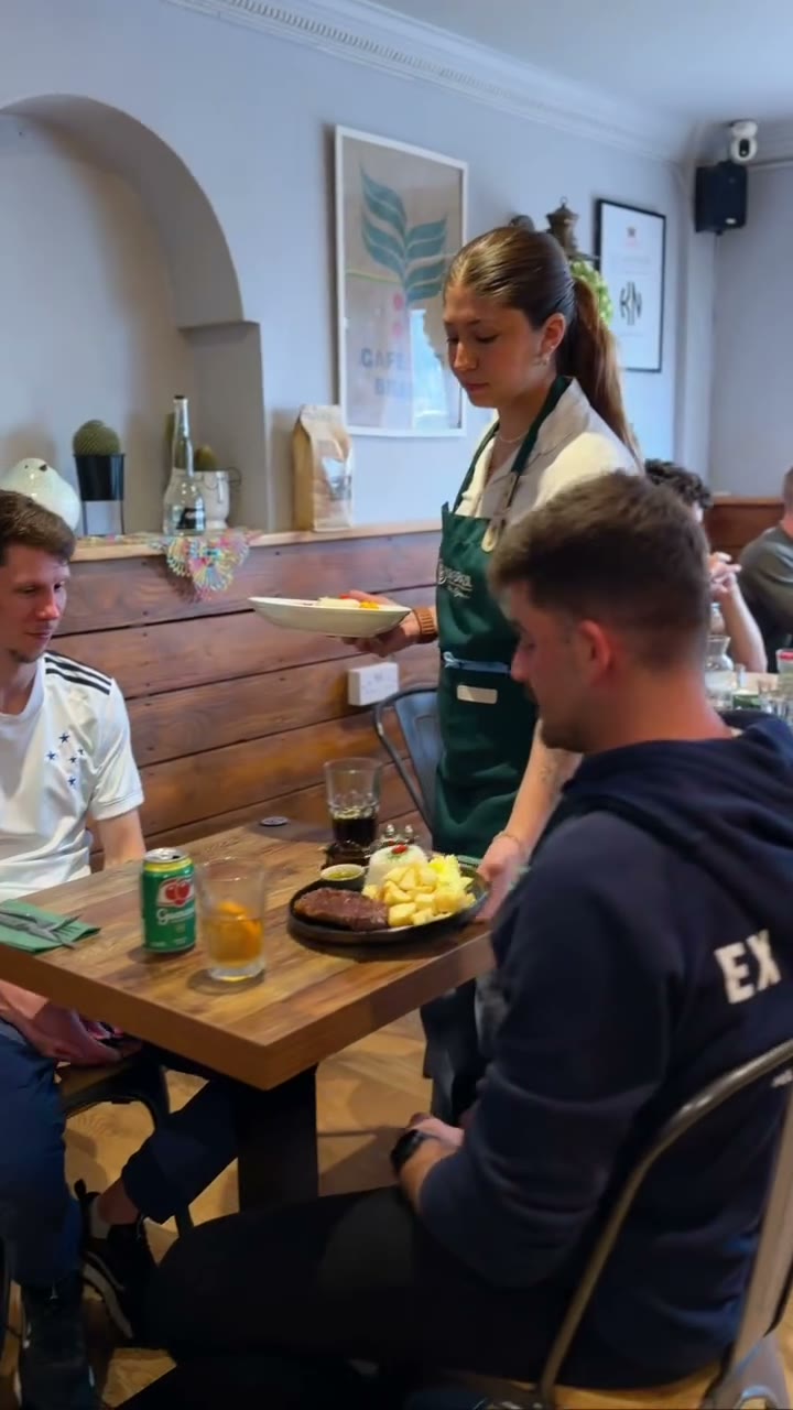Dining room with guests being served